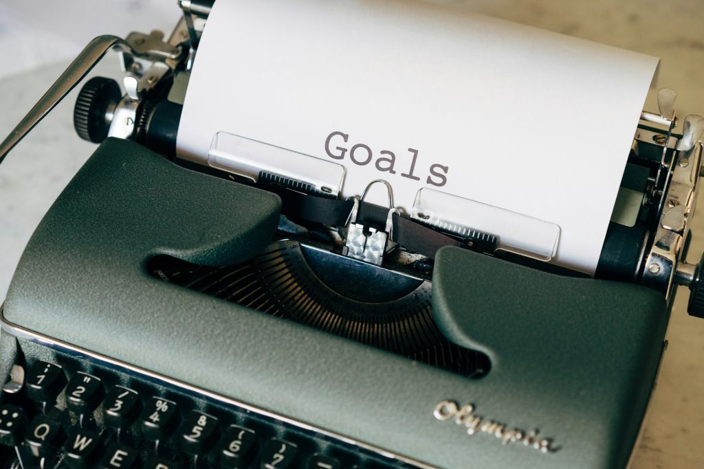 Picture of someone typing out goals they want to achieve