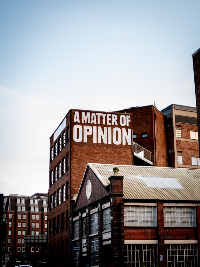 a wall with words "Matter of opinion" on it